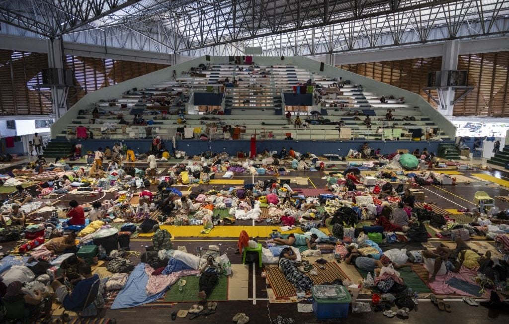 1444x920_hat-yai-thailand-november-28-displaced-people-at-a-gymnasium-used-as-an-evacuation-center-where-thousands-are-taking-shelter-from-the-floods-on-november-28-2025-in-hat-yai-thailand-although-the-off.jpeg