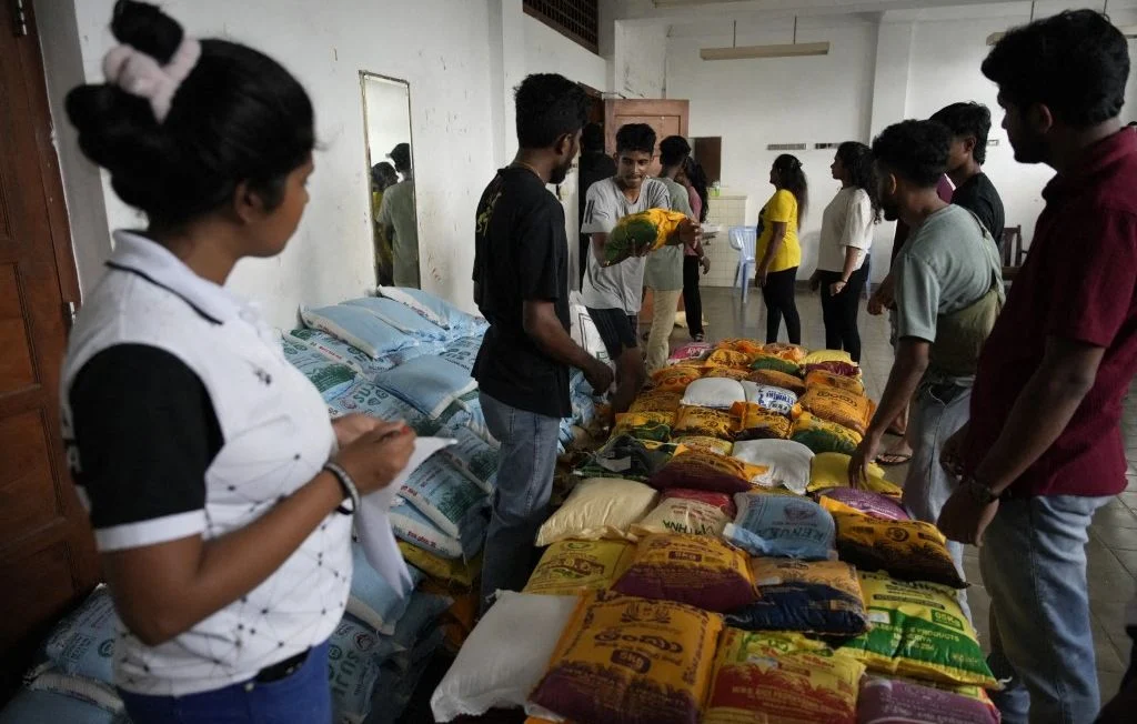 1444x920_people-volunteer-at-the-national-youth-service-center-in-maharagama-sri-lanka-on-november-29-2025-to-collect-pack-and-transport-aid-needed-for-flood-victims-in-sri-lanka-dry-food-essential-sanitary.webp