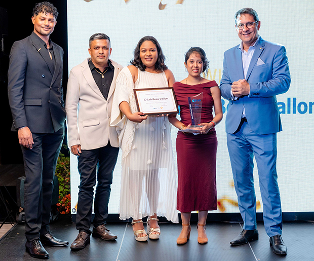 Photo 6 - C-Lab Beau Vallon team winner of Model Team Award Service Excellence Category with Daniel Grant.jpg